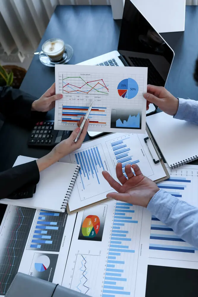 Team of business people working together in the meeting room office, teamwork background charts and graphs banner